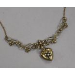 An early 20th century 9ct gold and seed pearl set heart shaped drop pendant necklace, approx. 52cm