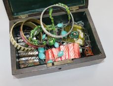 A box of mixed costume jewellery.