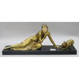 An Art Deco lady and dog figure group, on black marble base width 45cm height 19cm