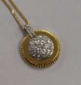 An 18ct gold and diamond cluster disc pendant, on an 18ct gold fine link chain, pendant 20mm.