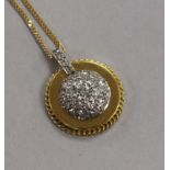 An 18ct gold and diamond cluster disc pendant, on an 18ct gold fine link chain, pendant 20mm.