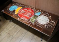 A 1960's tile topped coffee table W.123cm