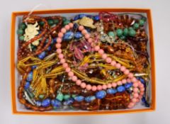 Assorted necklaces including amber with yellow metal clasp.