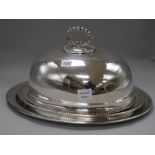 Two oval silver plated meat dishes and a meat dish cover