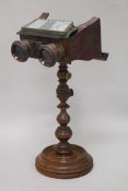 A Victorian stereoscope on stand and a tin plate stereo viewer etc height 37.5cm