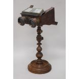 A Victorian stereoscope on stand and a tin plate stereo viewer etc height 37.5cm