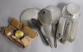 Mixed dressing table items including silver brushes, silver mirrors and silver mounted powder jar.