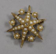 A Victorian 18ct gold, split pearl and diamond set starburst pendant brooch, 28mm.