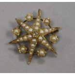 A Victorian 18ct gold, split pearl and diamond set starburst pendant brooch, 28mm.