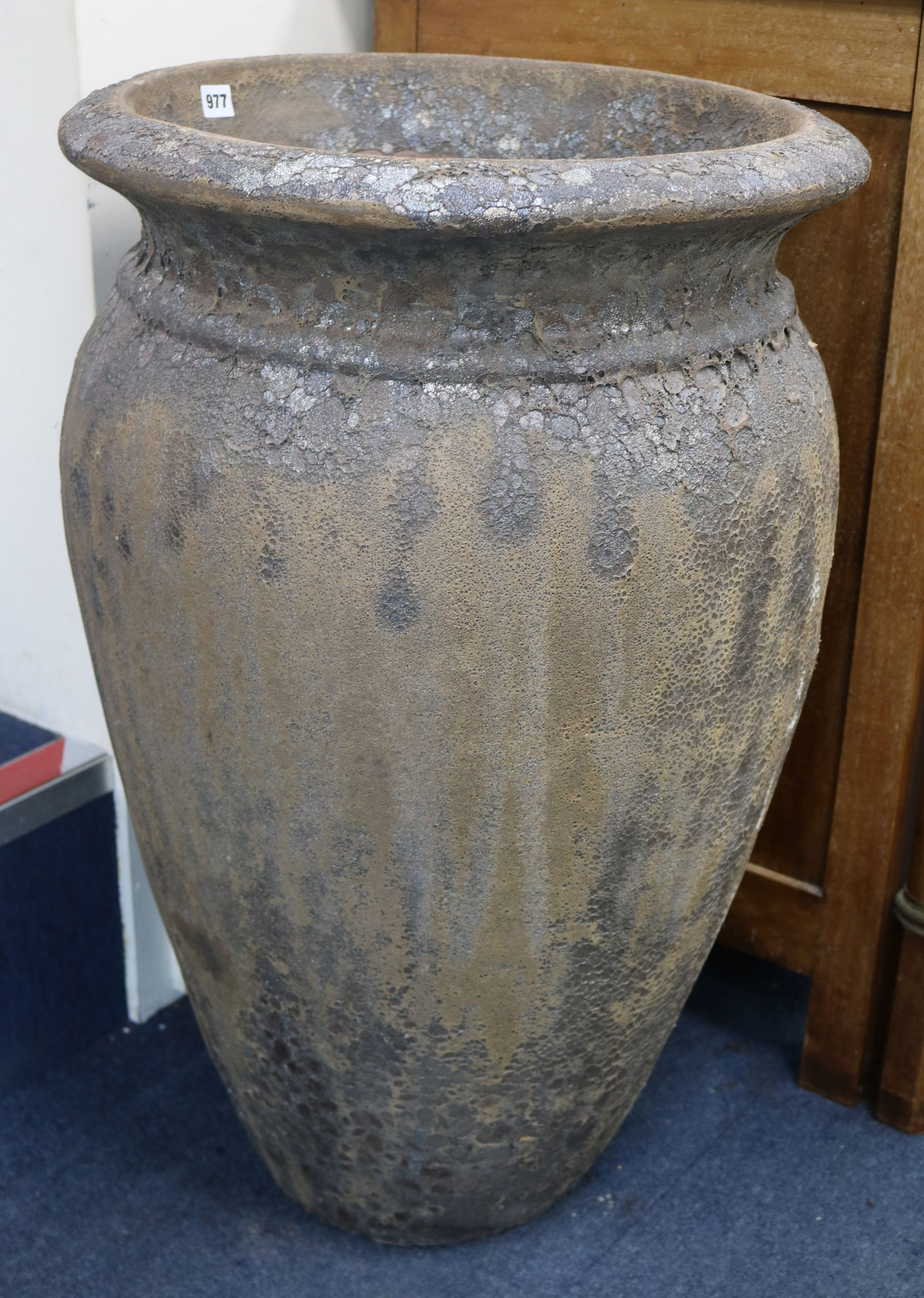 A pair of terracotta glazed urns W.53cm