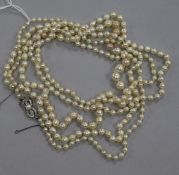 A long single strand graduated baroque cultured pearl necklace, with 14ct white gold Mikimoto clasp,