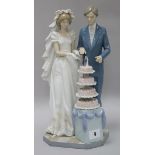 A Lladro bride and groom height 34cm