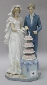 A Lladro bride and groom height 34cm