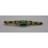 A modern 18ct gold, green tourmaline and diamond set bar brooch, 61mm.