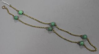 A 9ct gold fancy link and green hardstone bead necklace, 55cm.