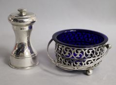 A George V silver butter with handle and liner and a silver pepper mill.