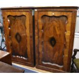 A pair of 19th century Continental walnut cupboards W.101cm