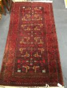 A Caucasian red ground rug 190 x 100cm