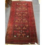 A Caucasian red ground rug 190 x 100cm