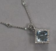 A modern white metal, aquamarine and diamond set square cluster pendant, on a gem set 18ct white