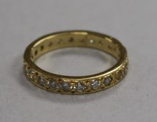 A modern 18ct gold and two colour diamond set full eternity ring, size N.