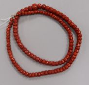 A single strand graduated facetted coral bead necklace, 69cm.