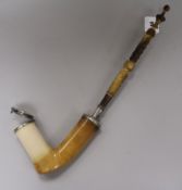 A Victorian white metal mounted horn and meerschaum pipe, engraved with a crest probably for the