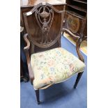 A pair of Hepplewhite style mahogany elbow chairs