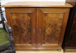 A German walnut two door cupboard W.112cm