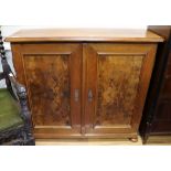 A German walnut two door cupboard W.112cm