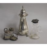 A George V silver mounted whisky tot, a silver sugar caster and a part condiment set.