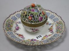 A Thuringian porcelain inkwell with pierced and flower-encrusted cover on conforming circular