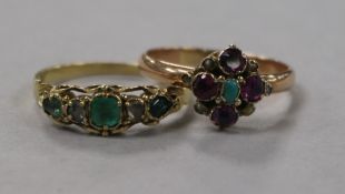 An early 20th century yellow metal and gem set 'Suffragette' ring and a similar emerald and