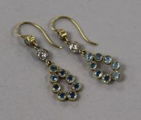 A pair of yellow metal, aquamarine and diamond drop earrings, one stone replaced?, 26mm.