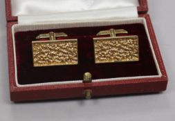 A pair of early 1970's textured 9ct gold rectangular cufflinks, in Asprey's box, 24mm.