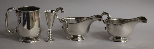 A silver Christening mug, Sheffield 1938, a pair of silver sauce boats and a kiddush cup, the