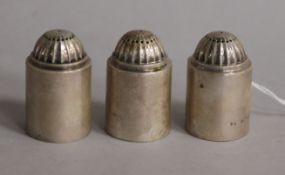 A set of three early 20th century Georg Jensen Danish sterling silver pepperettes, no.627, import
