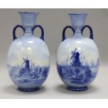 A pair of Doulton blue and white vases height 23cm