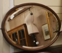 A Victorian oval wood mirror W.86cm