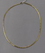 A textured yellow metal necklace, 43.5cm.