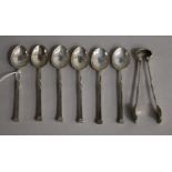 A set of six George V Arts & Crafts Omar Ramsden teaspoons and matching sugar tongs, London, 1922.