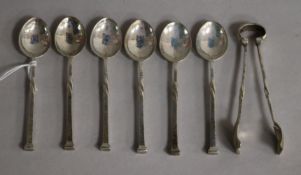 A set of six George V Arts & Crafts Omar Ramsden teaspoons and matching sugar tongs, London, 1922.