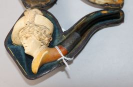 A cased meerschaum pipe