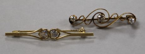An early 20th century yellow metal and three stone diamond bar brooch and one other 9ct gold bar