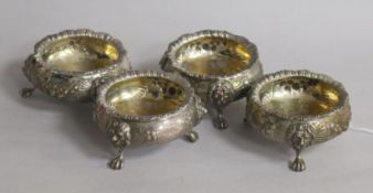 A set of four Victorian silver embossed bun salts, Charles Boyton II, London, 1870, width 8cm, 11