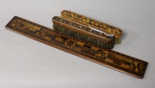 A Tunbridge Ware ruler and two clothes brushes, varied decoration including floral and perspective