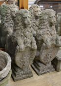 A set of four reconstituted stone lions bearing shields, W.25cm H.81cm