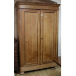 A Victorian pitch pine two door wardrobe W.149cm