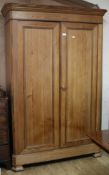 A Victorian pitch pine two door wardrobe W.149cm