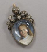 An early 20th century yellow metal and diamond set pear shaped miniature portrait pendant, 35mm.